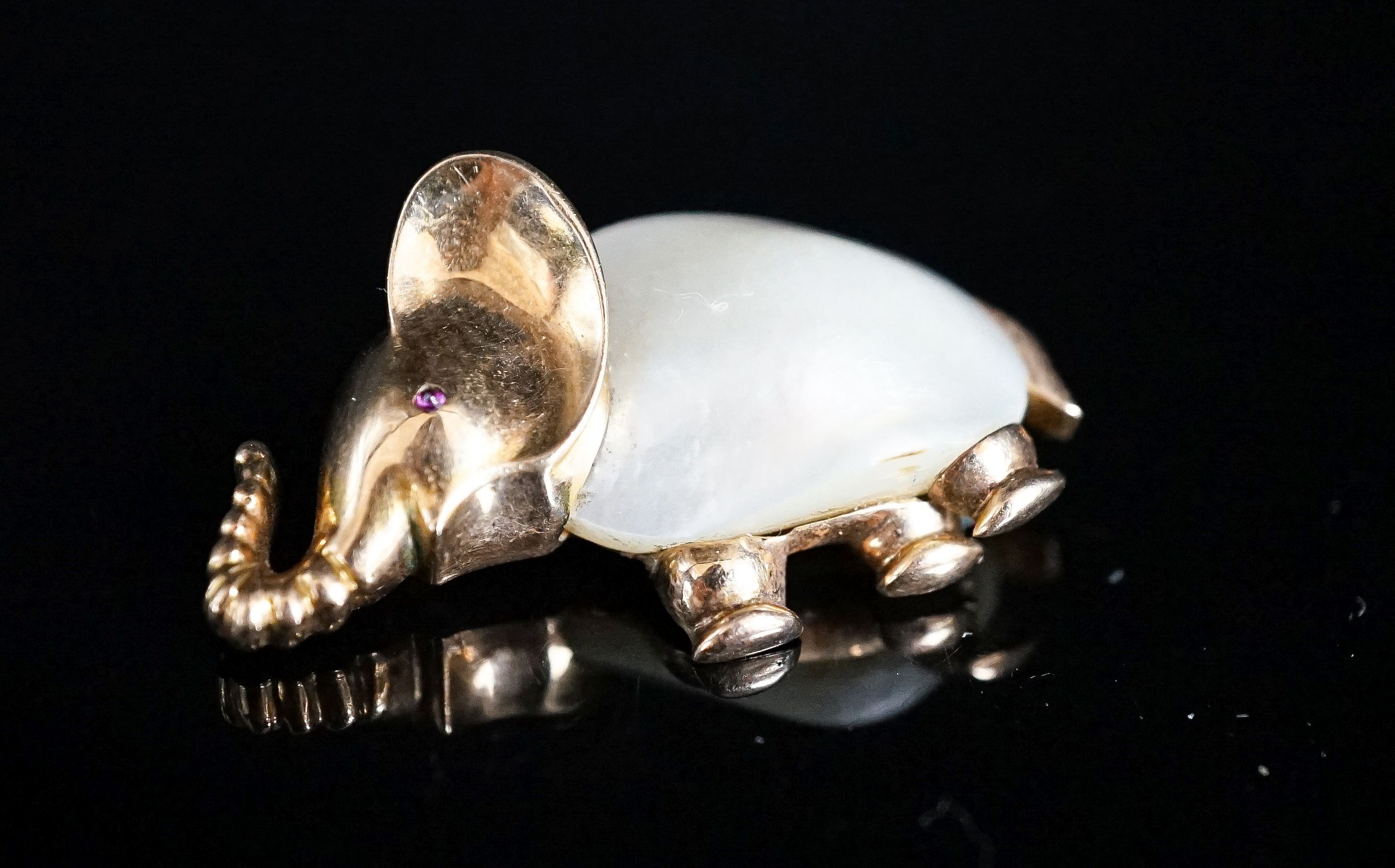 A 20th century Viennese 585 yellow metal, mother of pearl and cabochon set brooch, modelled as an elephant, 36mm, gross weight 10 grams.